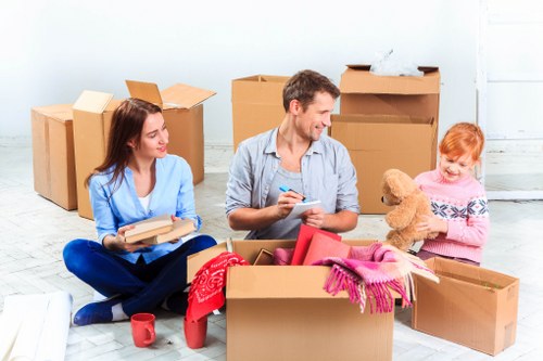 Carefully labeled moving boxes and packing materials in Eastsheen