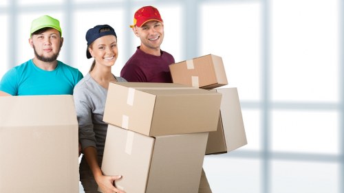 Organised office storage boxes and equipment prepared for collection in Eastsheen