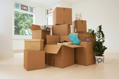 Removal team carefully loading furniture for storage and transport in Eastsheen